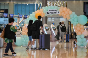 Passengers at the departure hall of Changi Airport Terminal 4 on Sept 13, 2022. 
