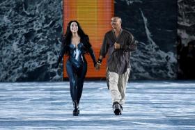 US singer and Oscar winner Cher (L) walks next to French fashion designer Olivier Rousteing as she presents a creation for the Balmain Spring-Summer 2023 fashion show during the Paris Womenswear Fashion Week on Sept 28, 2022.