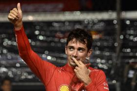 Ferrari&#039;s Charles Leclerc after taking the pole position in the qualifying session ahead of the Formula One Singapore Grand Prix night race at the Marina Bay Street Circuit in Singapore on October 1, 2022.