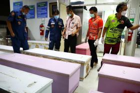 Coffins containing the bodies of victims at Udon Thani hospital in Thailand, on Oct 7, 2022. 