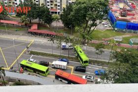 A Tower Transit bus ended up across a road divider after it crashed through the median railing at Ang Mo Kio Avenue 3 near 51@AMK mall on Wednesday (Oct 12).