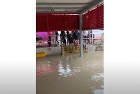 Flooding at Tanah Merah MRT station entrance during heavy rain on Saturday