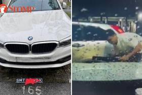BMW owner finds car plate on the ground, dashcam shows man trying to fix plate earlier