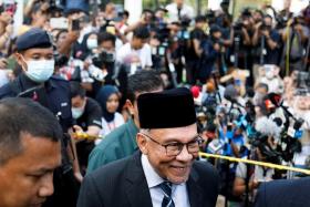 Malaysia&#039;s opposition leader Anwar Ibrahim speaking to the media outside the National Palace in KL on Nov 22, 2022. 