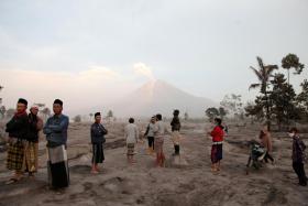 Indonesia's Mount Semeru erupted on Dec 4 spewing hot ash clouds a mile high and rivers of lava down its side while sparking the evacuation of nearly 2,000 people exactly one year after its last major eruption killed dozens.