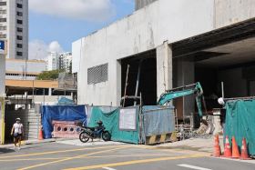 The car ploughed into two parked motorcycles before crashing into a fence at a construction site near Block 82 Marine Parade Central. 