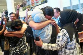 Victims of job scams in Myanmar finally safe in the arms of their family members on arriving at the Kuala Lumpur International Airport.