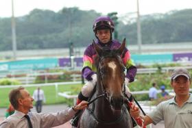 Steven Burridge leading Street Of Dreams (Manoel Nunes) in at his fourth win in a Class 3 Polytrack contest over 1,200m on Jan 14. 
