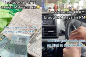 Grab driver accepts payment in ringgit to help student without SGD