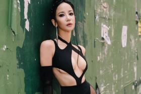 Blast from the past: Fiona Xie shows off her still-svelte figure in skimpy black outfit