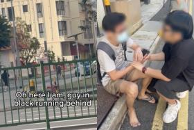 The video shows KameHao chasing the man and then trying to take his phone away from him. 