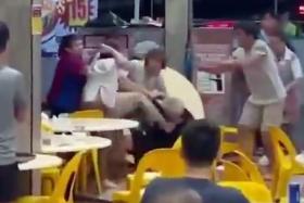 A video circulating online at first shows an elderly man sitting on the floor looking dazed being helped by two women.