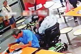 A man was caught on CCTV slapping his wheelchair-bound father in public.
