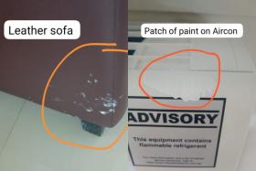 The sofa and air-conditioner had paint stains on them after the work was done.