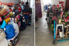 RT shared photos showing the second-floor corridor of Block 287A Compassvale Crescent stacked with numerous items such as laundry, plants and furniture.