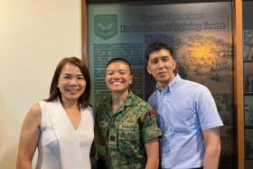 Captain Yap Hui Jun and her parents at the Ranger course graduation.