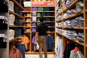 A shopper at the Uniqlo Flagship Store Orchard Central. PHOTO: ST FILE