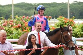 Greatham Boy (Daniel Moor) after landing the Group 3 Singapore Golden Horseshoe over 1,200m on July 23, 2023. The Australian-bred was then trained by Michael Clements (in tie). 