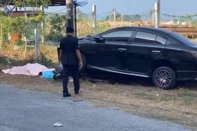 M'sia driver runs over alleged robber blocking his car