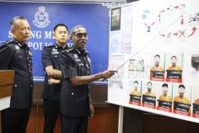 Johor police chief M. Kumar at the press conference following the arrest of the suspected members of a loan shark syndicate.