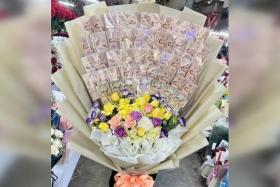Ms Sunitra Boonyaem bought a bouquet made of cash worth $2,000 for her boyfriend as a graduation gift.