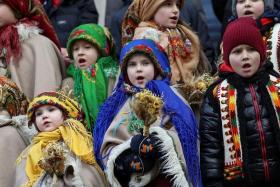 Children dressed in Ukrainian traditional costumes attend a Christmas celebration, in Lviv, Ukraine, on Dec 24.