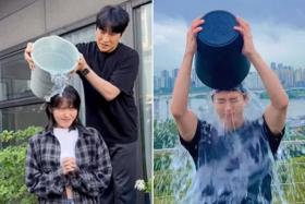 Singer-actress IU (left) and actor Park Bo-gum took part in the Ice Bucket Challenge on July 11.