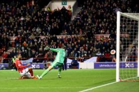 Nottingham Forest&#039;s Lewis Grabban scores their first goal.