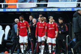 Manchester United players react after losing the match between Newcastle United and Manchester United.