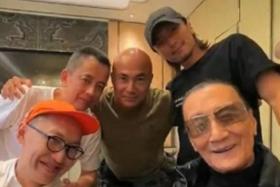 Patrick Tse (front, right) with his son Nicholas Tse (back, right), retired firefighter Sam Hui (back, middle) and other friends.