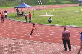 Aqil Naufal Zahiran, an 11-year-old pupil, taking part in the school athletic championships for special education students in Jerantut, Pahang.