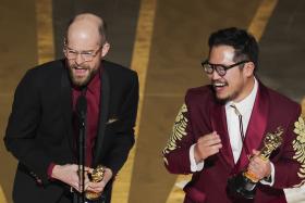 Daniel Kwan and Daniel Scheinert win the Oscar for Best Director for Everything Everywhere All At Once during the Oscars show at the 95th Academy Awards in Hollywood, Los Angeles on March 12, 2023. 