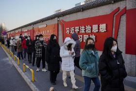 Beijing residents queueing to take Covid-19 tests on Dec 6, 2022. 