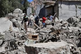 Residents searching through the rubble of their homes in Imoulas village, Morocco, on Sept 11.