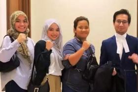 (From left) Students Calvina Angayung, Nur Natasha Allisya Hamali, Rusiah Sabdarin and their lawyer Sherzali Herza Asli.