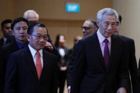 Mr Seah Kian Peng (left) with PM Lee Hsien Loong at the FairPrice Group&#039;s 50th anniversary gala dinner on July 22, 2023.