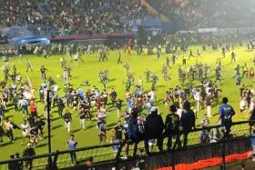 After Arema lost 3-2 on its home field at the Kanjuruhan Stadium, dozens of fans rushed to the field.