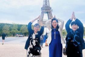 Ms Rui Matsukawa (centre) posted a photo of herself and two participants mimicking the shape of the Eiffel Tower in front of the historical landmark.