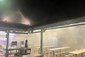 The hawker centre can be seen filled with thick smoke on March 24.