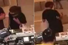 CCTV footage shows a woman walking away with a bag of food from the Duckland restaurant on April 22.