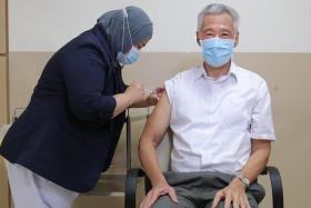 PM Lee Hsien Loong getting a shot of the updated Covid-19 vaccine at the Singapore General Hospital on Nov 2.