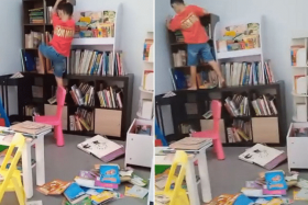 Screengrabs of a video showing a child scaling bookshelves at a Boon Lay community library, with books strewn across the floor.
