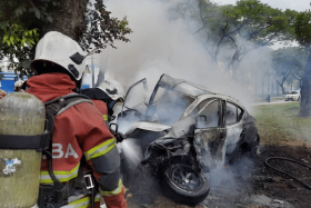 The car – believed to be a Nissan Almera – crashed into a tree on the side of the road and burst into flames, trapping the driver.