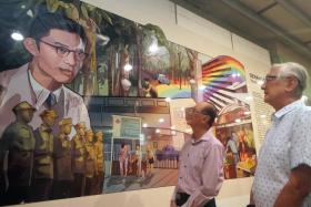 Dr Lim Whye Geok (pink top) and Mr Lim Lam Geok, the children of WWII hero Lim Bo Seng, with the mural featuring their late father at Serangoon MRT station.