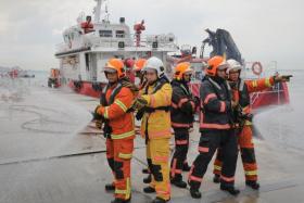 SCDF firefighters from Brani Marine Fire Station and Marina Bay Fire Station who had responded to the fire at Kusu Island on April 17.