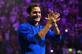 Roger Federer does a lap of honour after playing his final match in the 2022 Laver Cup at London's O2 Arena on Sept 24.