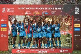 Fiji celebrating after they defeated New Zealand to win the HSBC Singapore Rugby Sevens on April 10, 2022.