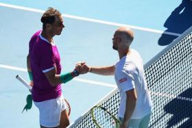Nadal (left) beat Frenchman Adrian Mannarino in a 7-6 (16-14), 6-2, 6-2 victory.