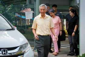 Prime Minister Lee Hsien Loong and his wife, Madam Ho Ching, leaving the polling station at Crescent Girls’ School on Sept 1.
