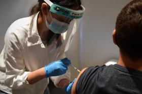Nine out of 10 people in Singapore have now completed the basic vaccination regimen and half the population have received their booster shots.